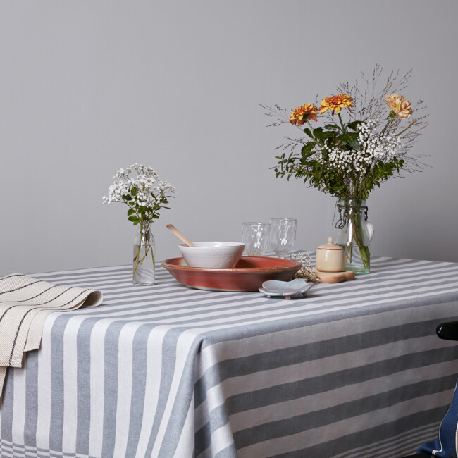 Klässbols jeans blue Gästabud linen towel with Gärdet towel with white and black stripe. Bolster cushion in the corner 