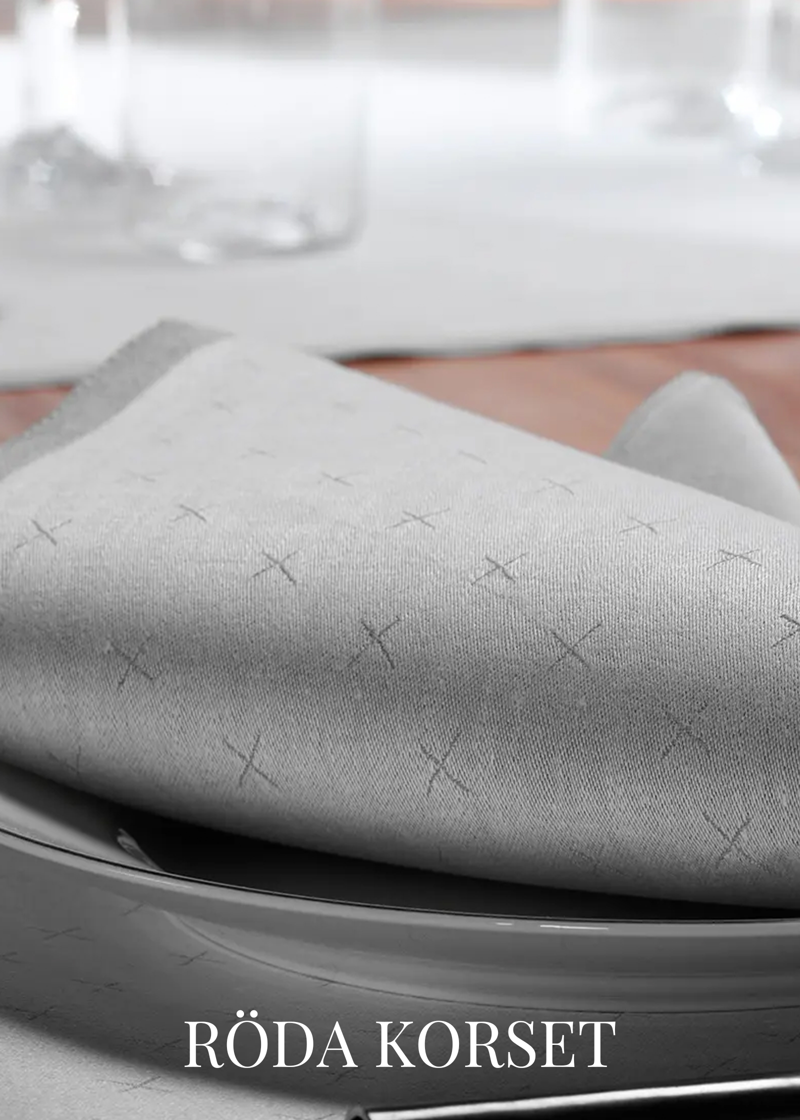 Collaboration with red cross and klässbols linen weaving - napkins and linen textiles in grey.
